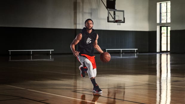 Stephen Curry dribbling the basketball.